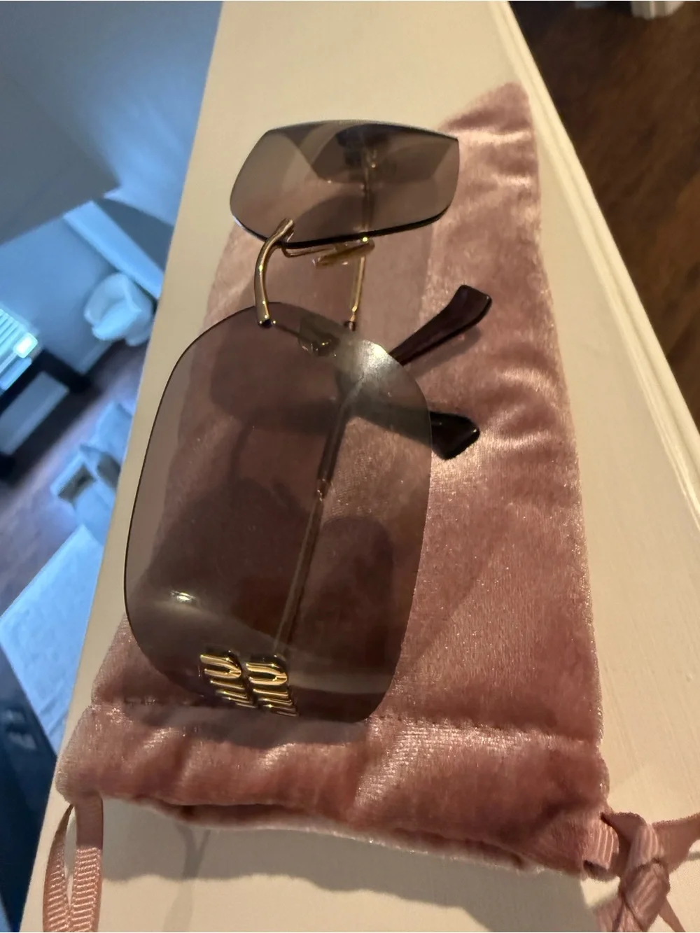Miu Miu Gold-Accented Pink Gradient Rimless Shield Sunglasses